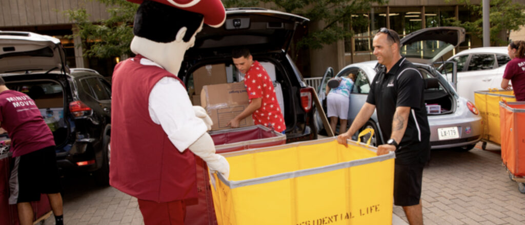 DormDrop team delivering boxes around UMass campus